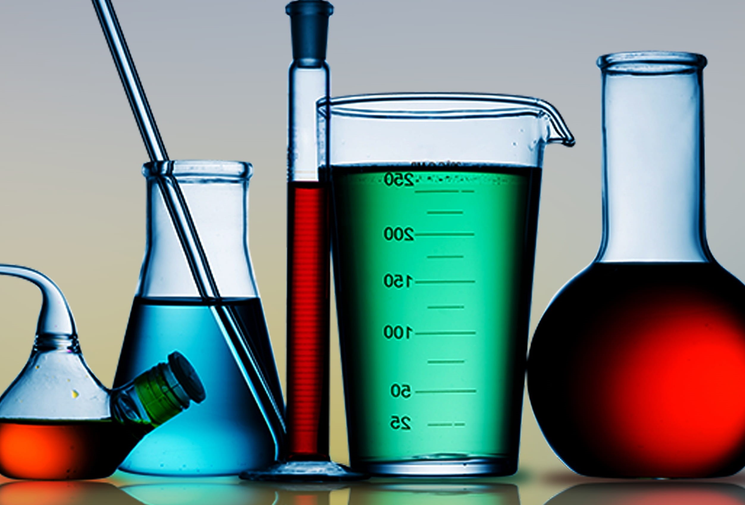chemistry glassware with colored liquids